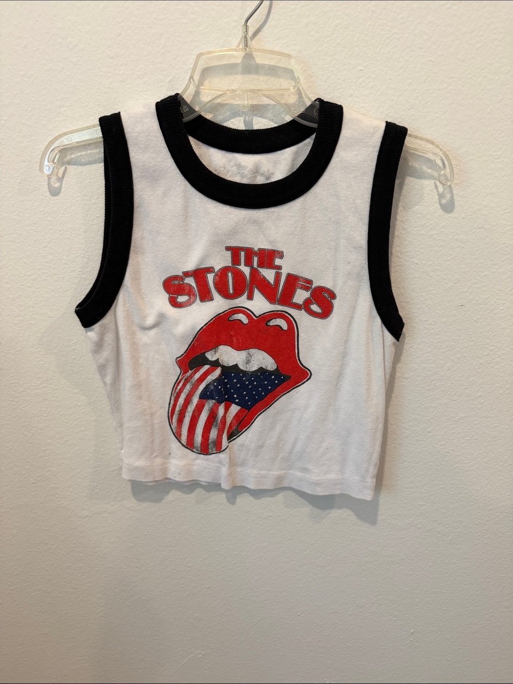 the Rolling Stones White Crop Tank with Black Trim and Red Graphic